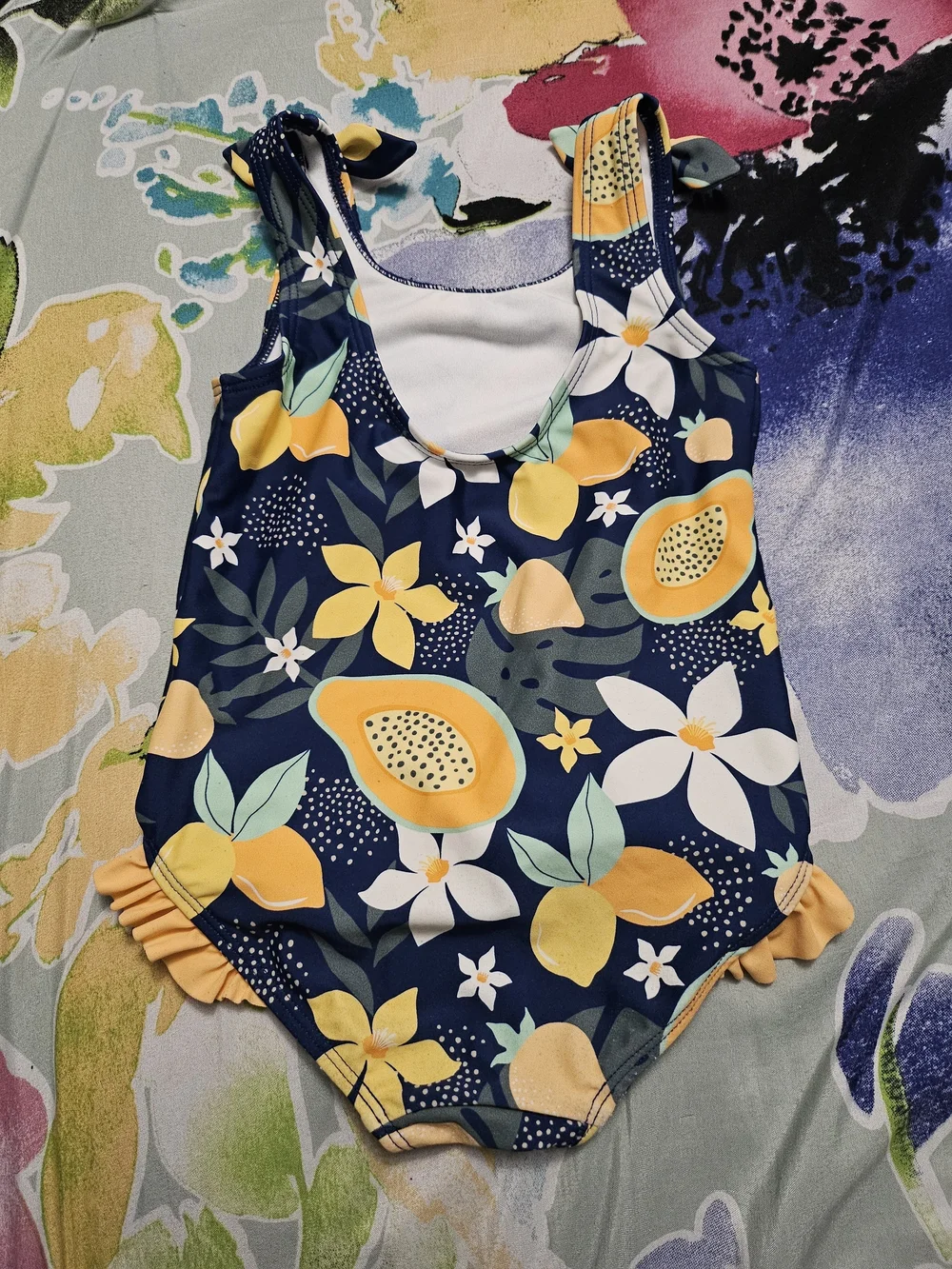Ruffle Butts Navy One-Piece Swimsuit with Yellow Fruit Print